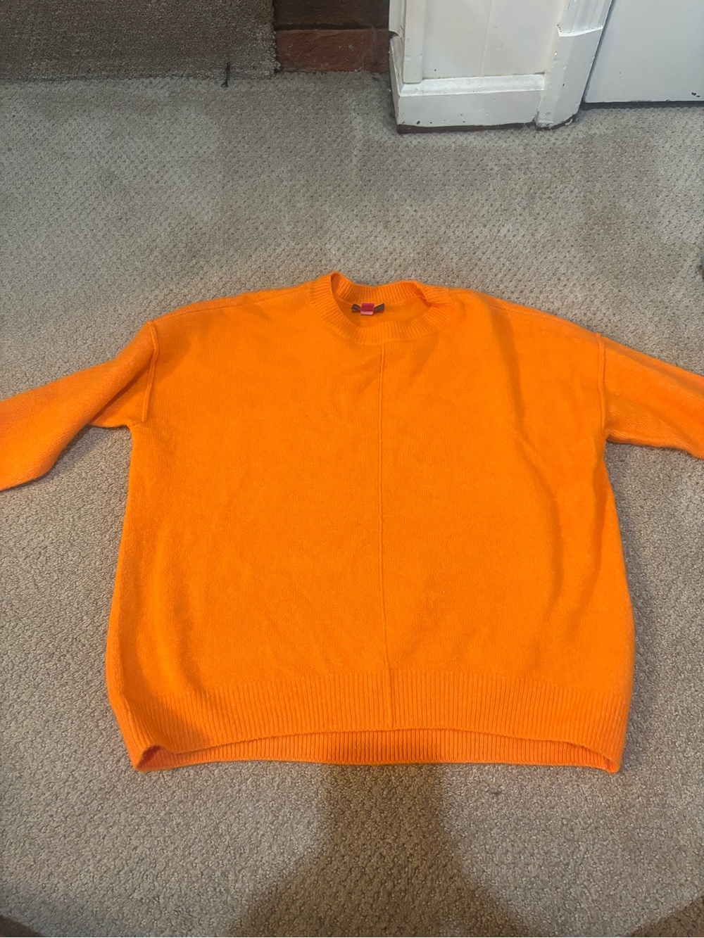 Women’s orange sweater
